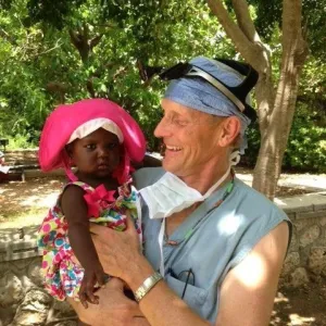Dr. Stephen N. Doran Memorial holding a small child